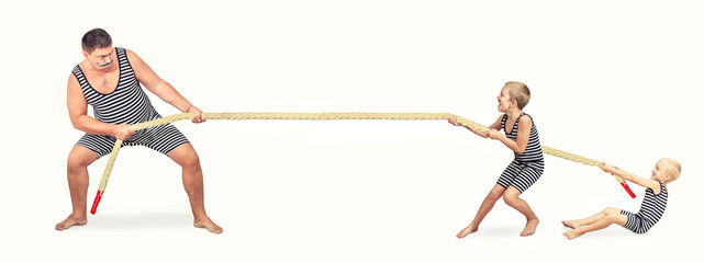  Family of strongman. Father and two sons in vintage costumes drag the rope. Family look.