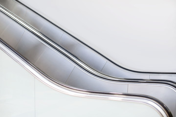 escalator shopping mall in wide angle without people high key white color