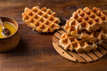 Honey Waffle Put On white Plate, honey waffle put on wooden table, delicious honey waffle