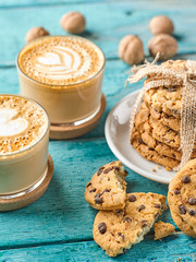 Cup of hot coffee and sweet chocolate cookies