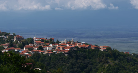 Fototapeta na wymiar View of Signagi and Alazani Valley. Popular tourist attraction of Georgia. The heart of Georgia's wine-growing regions.