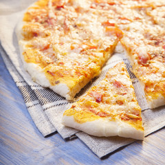 Pizza and Coffee on wooden table, cup of cappuccino.