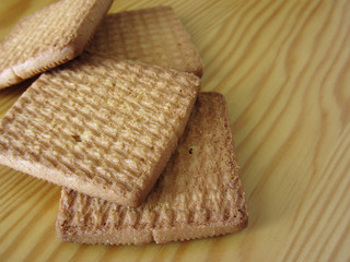 Close up of cookies on wooden table . Four biscuits for breakfast