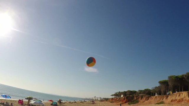 Father Plays Beach Volleyball With His Daughter. Shooting From The First Person.