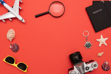 Fototapeta na wymiar Summer Travel accessories on red background
