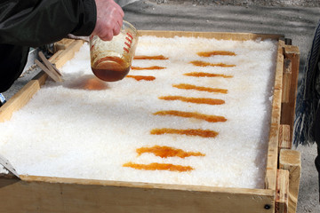 Hot Maple Syrup Pouring On Snow For Taffy