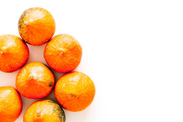 Pumpkin background for halloween. Pumpkins on white background top view copy space