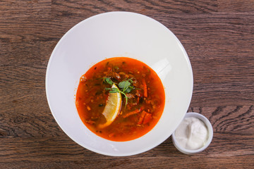 Solyanka soup with lemon