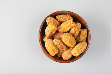 Indian dry dates in a wooden bowl