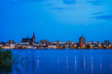 Naklejka na ściany i meble Rostock. Night Panorama view to Rostock in Germany. River Warnow and City port.