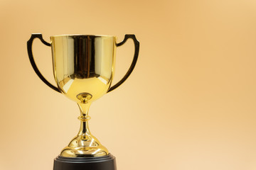 Golden trophy on background