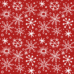 Seamless pattern with hand drawn sketch snowflakes.