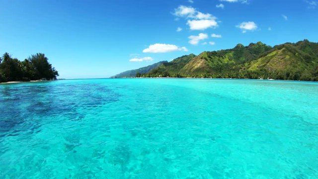 Boat travels past Tahiti coast, POV