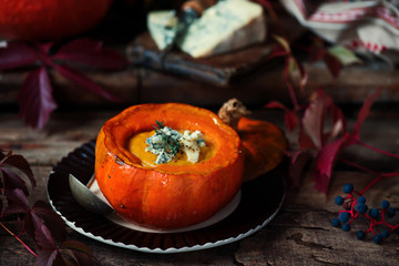 Pumpkin and pear soup with blue cheese.style rustic