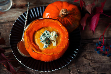 Pumpkin and pear soup with blue cheese.style rustic