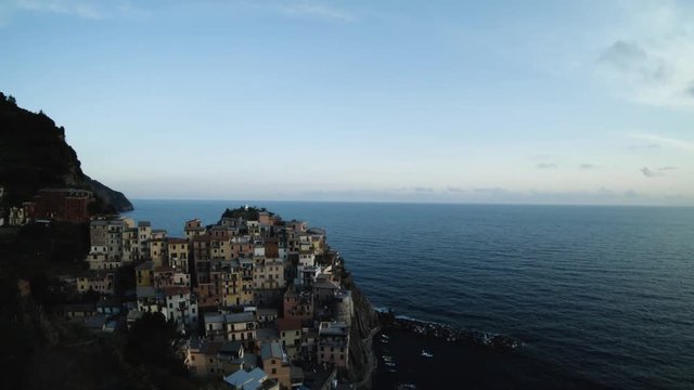 Pan left aerial, scenic coastal town in Italy