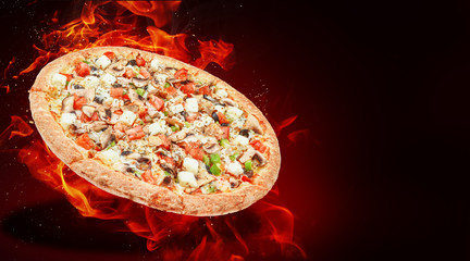 hot fresh traditional italian pizza in flames - obrazy, fototapety, plakaty