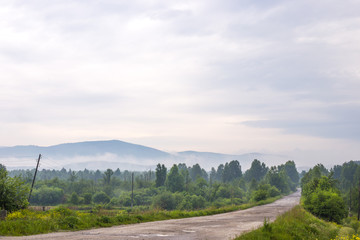 Fototapeta na wymiar Ural mountains in the morning mist