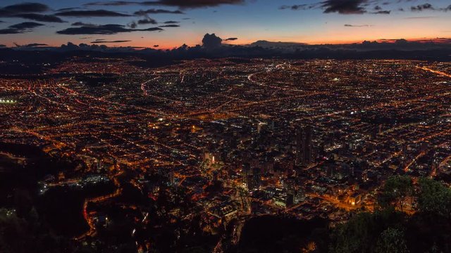 Dusk wide timelapse of vibrant Bogota city megalopolis, capital of Colombia, with swarming traffic.