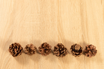 pine cones on wooden table