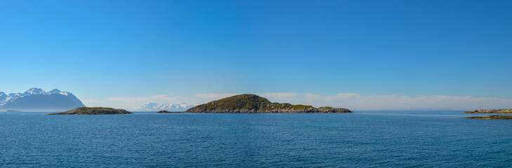 Panoramic view of three green islands on the nordic sea, Lofoten islands, Norway.