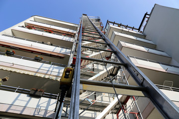 Scaffold with construction hoist