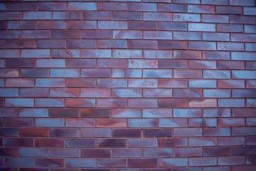 Brick wall, a texture of red and white stone blocks closeup