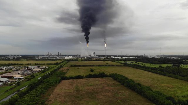 Chemical Plant Conducting Controlled Flaring to Burn Off Excess Materials in Channelview near Houston, Texas Filmed by Drone