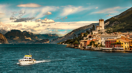 Landscape of Lake Garda with boat and Tignale in background 