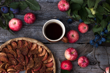 Apple pie on wooden rustic background.