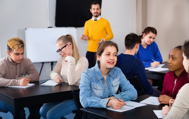 Fellow students having group work tasks during school day