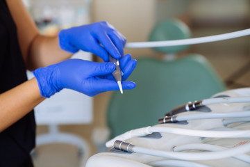 Close-up medical equipment of a dentist in the hands of a doctor. dental clinic, concept of healthy.
