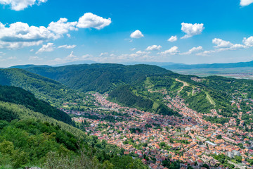 Fototapeta na wymiar Brasov residential area at the foothill of the mountain