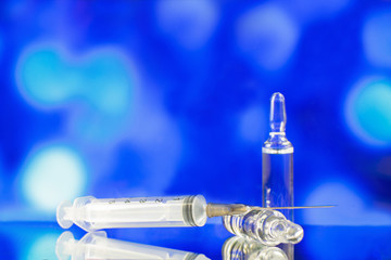 injection syringe with needle and ampoules with the drug