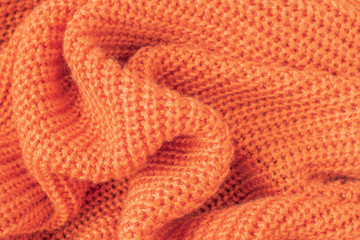 Soft knitted fabric from orange fluffy yarn