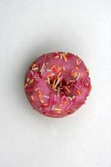 donut donuts sprinkles on doughnuts copy space flat lay pink bright sugar strands background