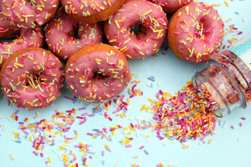 donut donuts sprinkles on doughnuts pink bright sugar strands background