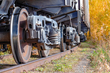 Wheels of freight cars. The concept of logistics by rail. Delivery of cargo by rail.
