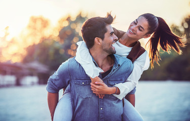 Couple having fun on the beach. Lifestyle, love, dating, vacation concept