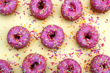 donut donuts frosting sprinkles on doughnuts pink bright sugar strands background icing  in plastic pink 