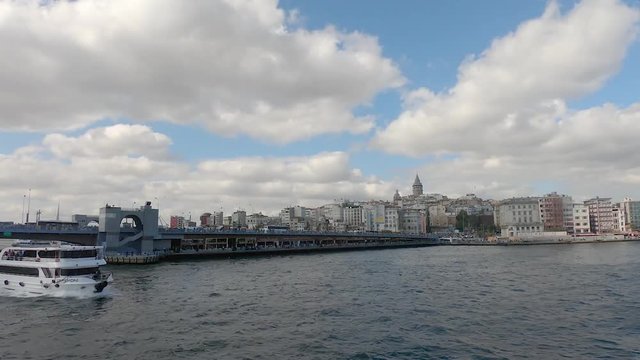 istanbul, Turkey - October 2018: Galata bridge with passenger boats and pedestrians is a historical bridge in Eminonu, istanbul, Turkey