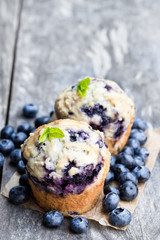 Delicious  blueberry muffins on wooden table