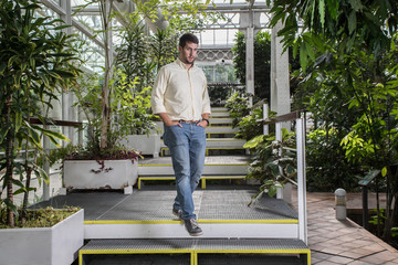 businessman going down metal stairs