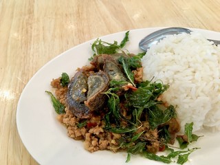 Basil with preserved egg topped with rice