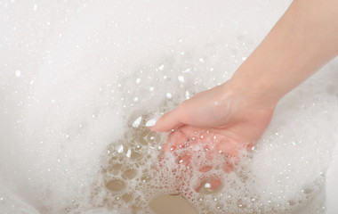 Beautiful woman in bath foam beauty health care body water