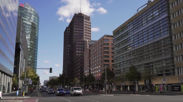 Famous potsdamer platz in berlin with tall skyscrapers and traffic car