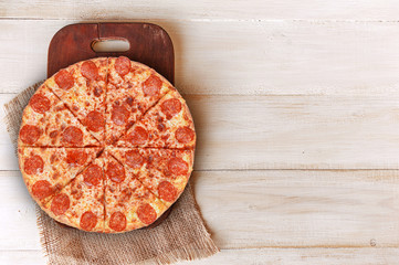Fototapeta na wymiar Hot Homemade Pepperoni Pizza Ready to Eat