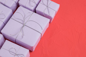 The heap of presents wrapped in lilac paper