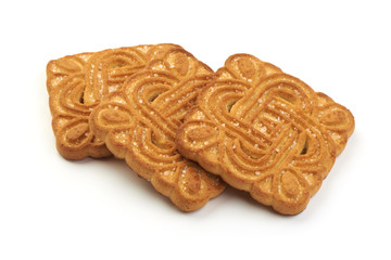 Heap of brown cookies with sugar, close-up, isolated on a white background.