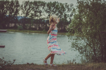 lovely child  dancing at the lake
